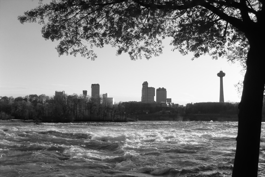 Niagara River with Canadian skyscrapers towering in the background.