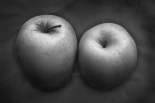 Two apples on a linen tablecloth
